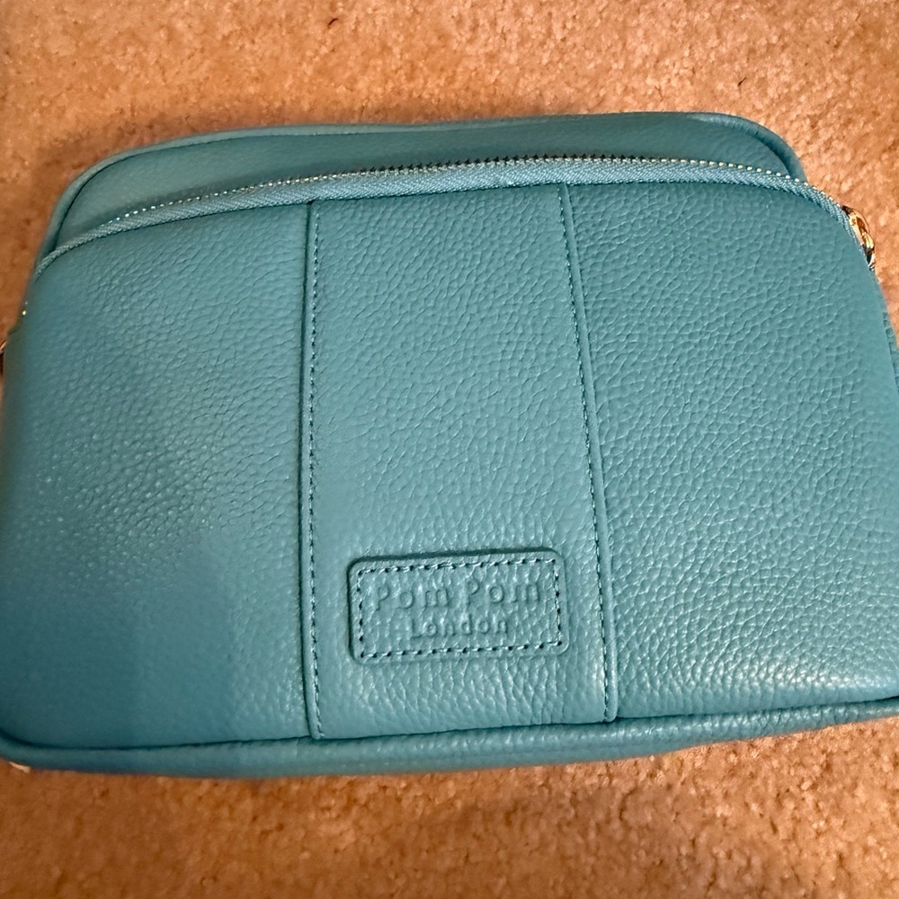 Stylish Teal Crossbody Bag by Pom Pom London